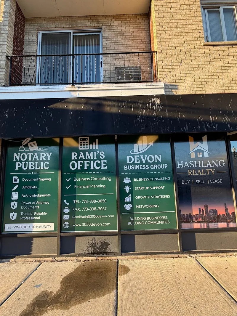 Green window graphics for Notary Public, Rami's Office, Devon Business Group and Hashlang Realty on a brick building