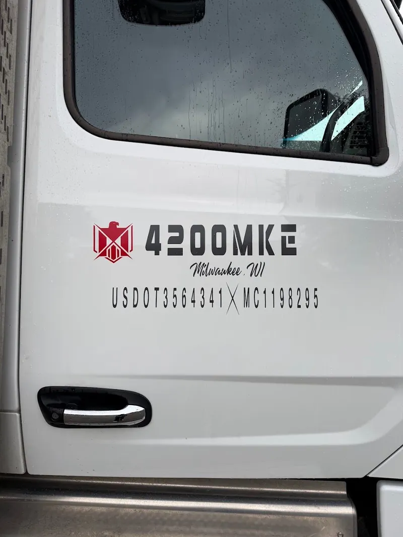 White truck door lettered with the 4200MKE logo, Milwaukee, and USDOT and MC numbers